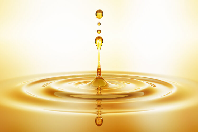 Drop of golden oil -  concept of wellness and beauty products - 3D illustration